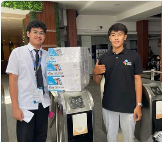 Staff handing over printing supplies