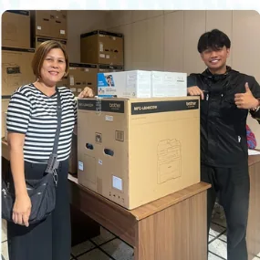 Customer receiving a boxed printer